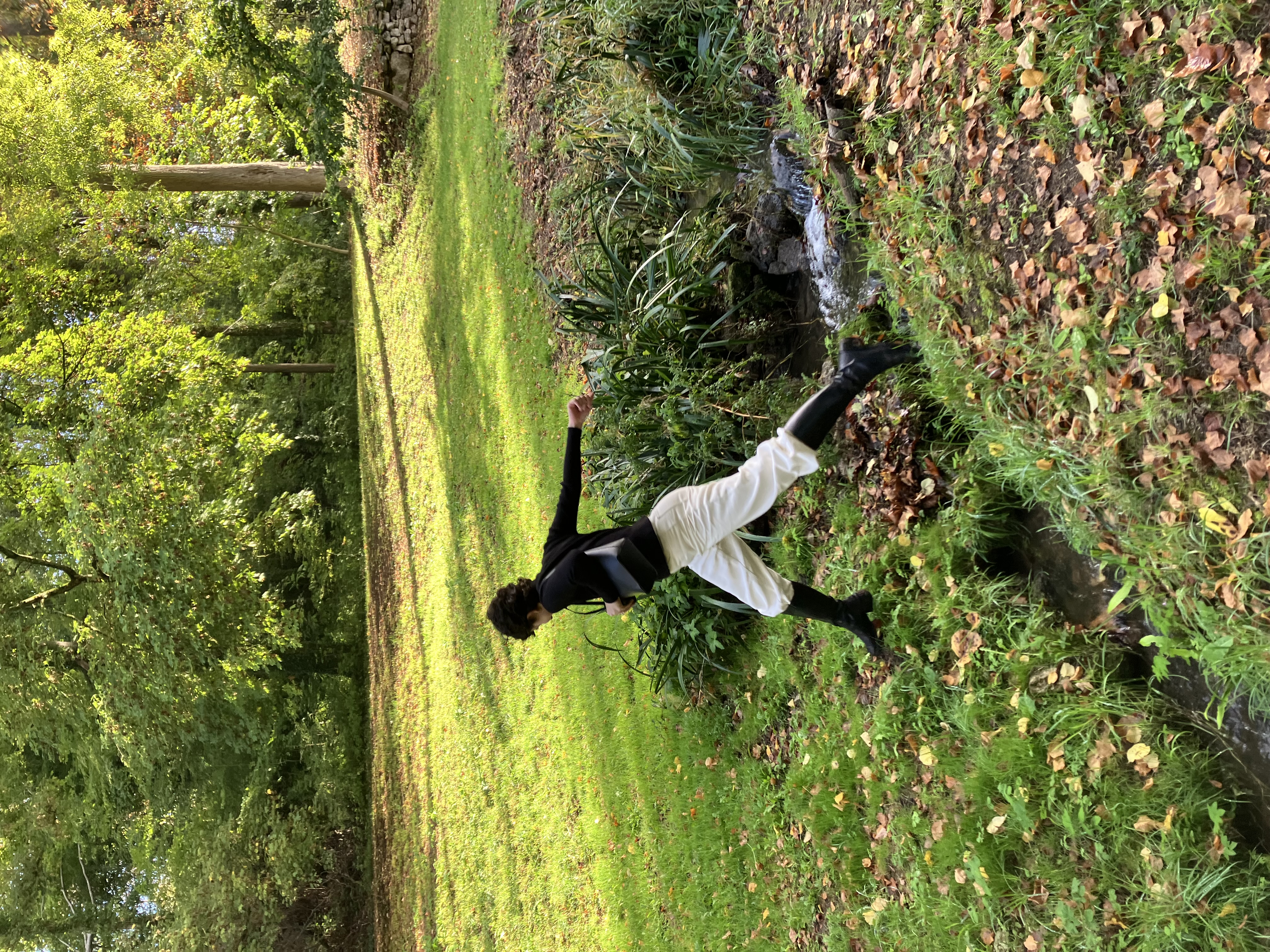 a picture of me hopping over a river in france